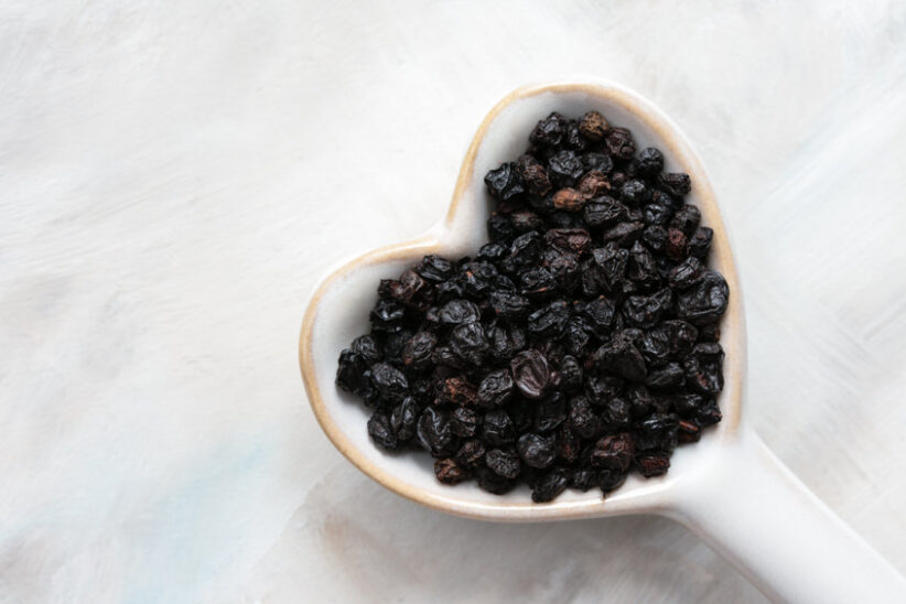 Dried European Elderberries in a Heart Shape Spoon