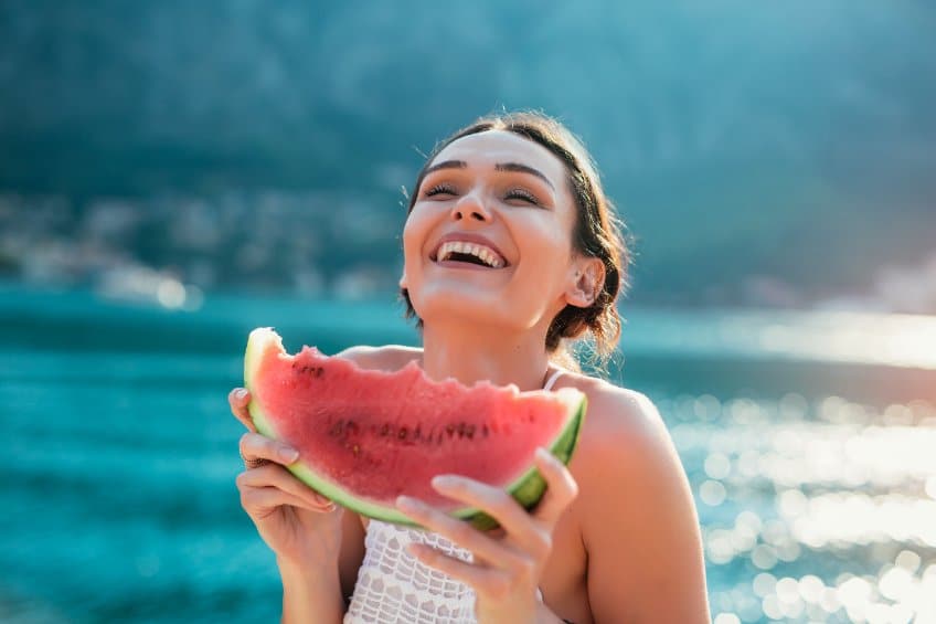 woman eating watermelon.