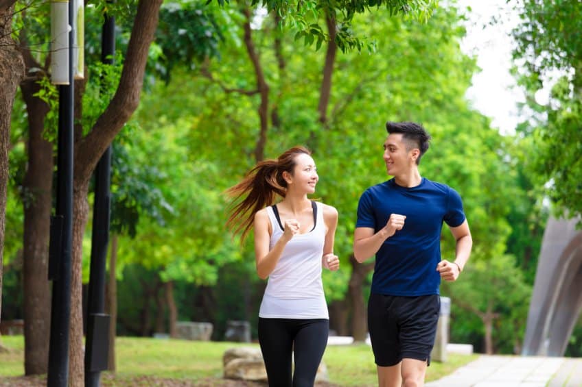 young Asian man and Asian woman jogging